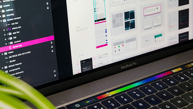 A MacBook displaying design software for web design, focusing on user interface and structure. Perfect for creating engaging UX for e-commerce.